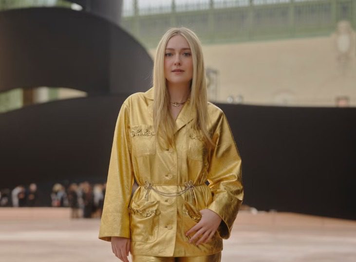Dakota Fanning Shines in Gold Leather Suit at Chanel’s Paris Show