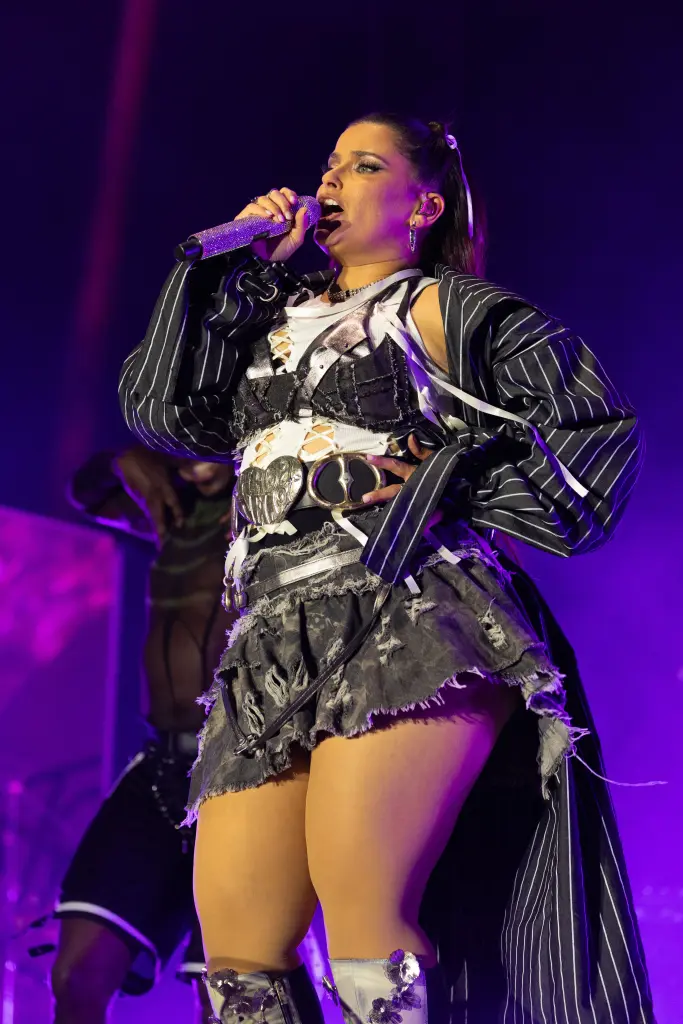 Nelly Furtado Rocks Cutout Top & Distressed Miniskirt