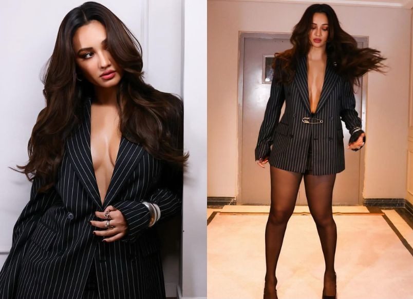 Akanksha Sharma Turns Heads in Pinstriped Blazer Dress and Sheer Tights