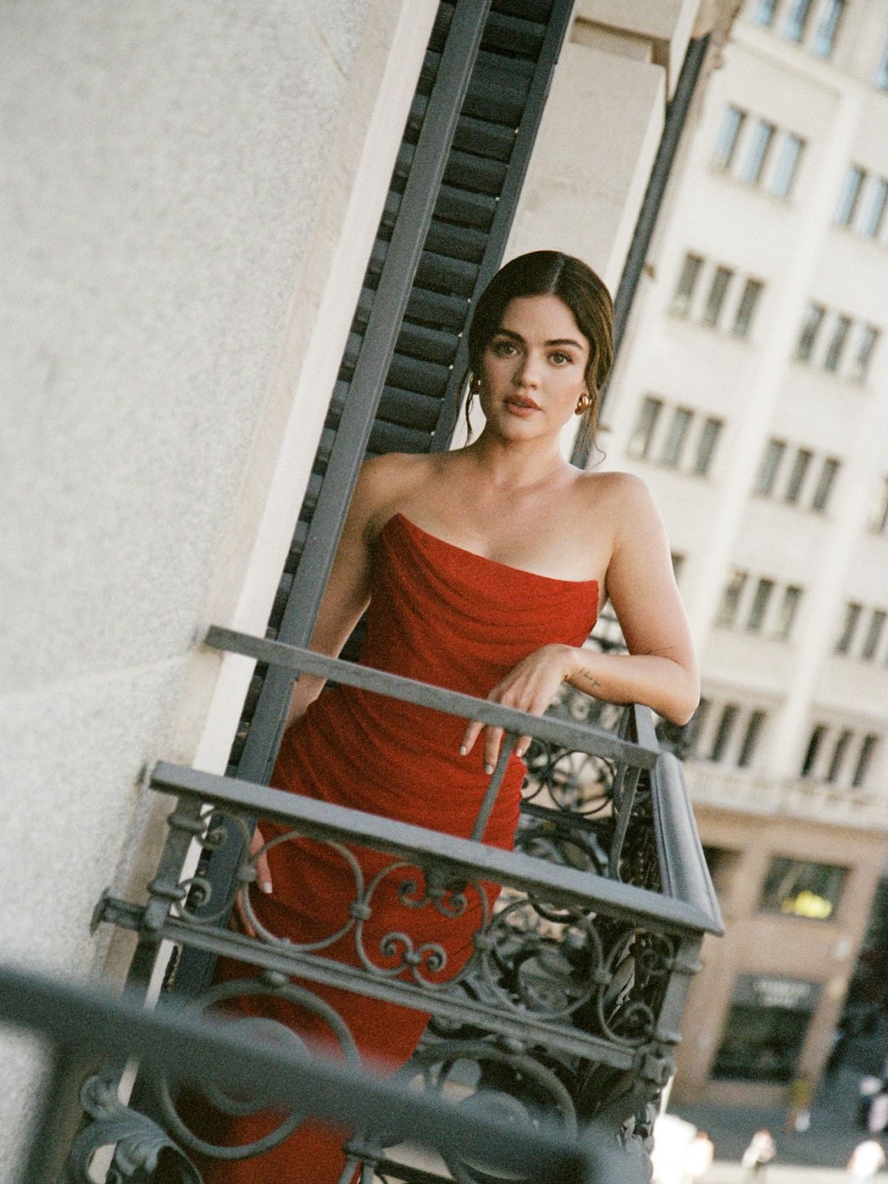 Lucy Hale Radiates Elegance in Scarlet Draped Dress