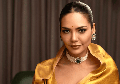 Esha Gupta Radiates Regal Elegance in Stunning Golden Saree